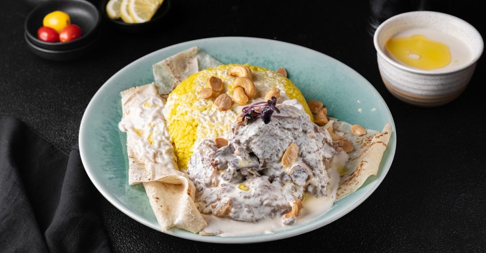 Jordanian mansaf lamb and rice dish, a popular choice for mansaf in Dubai, served at Adam Restaurant & Cafe